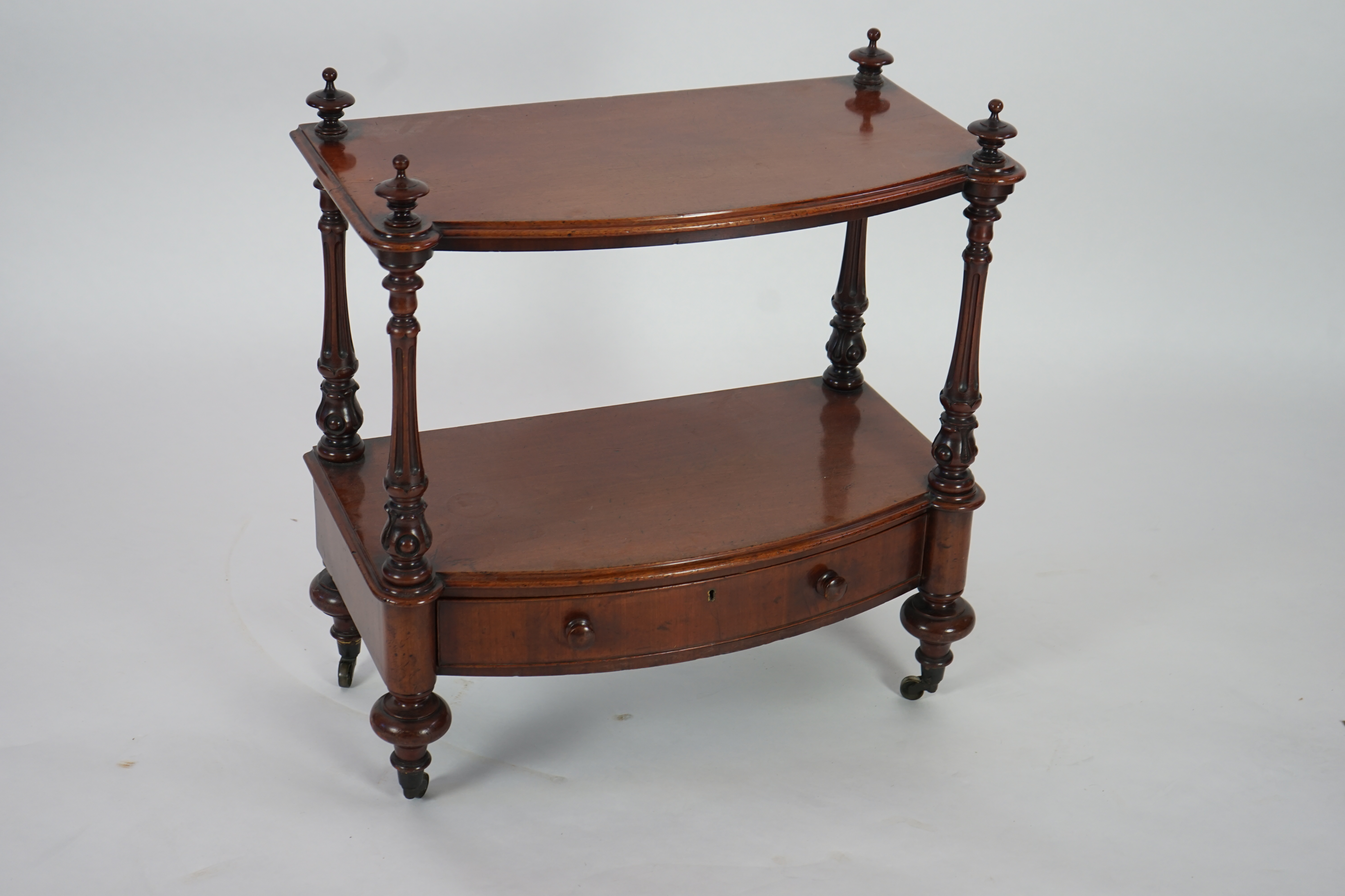 A Victorian mahogany bow fronted two tier whatnot, with fitted drawer, width 66cm, height 73cm. Condition - good